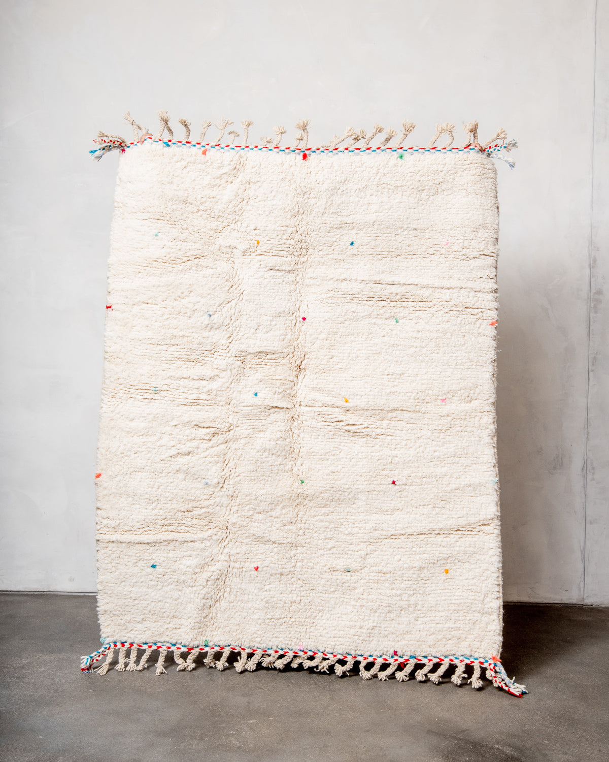 Modern, designer, handcrafted Berber rug from Morocco. Beniourain carpet with beautiful colours and patterns and fluffy wool texture.